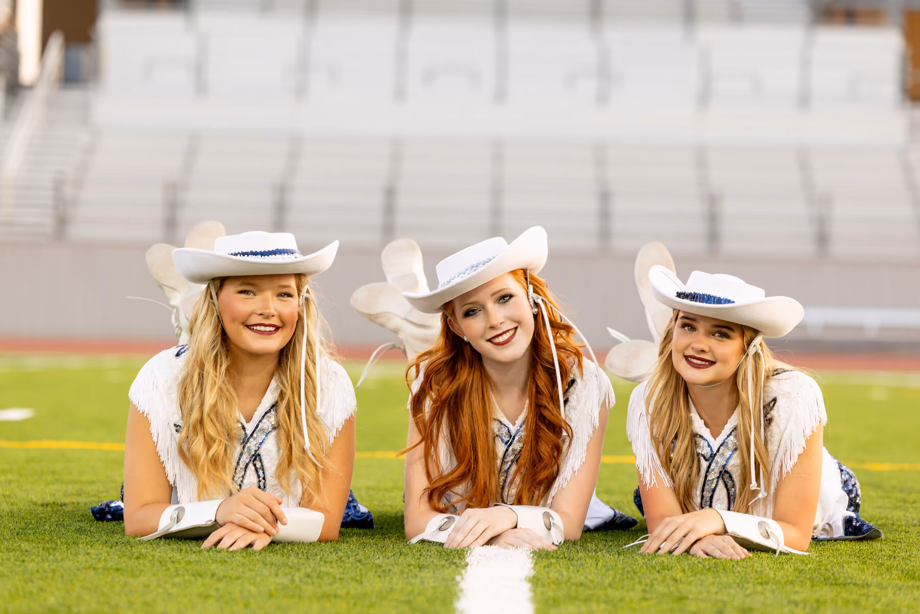 Three Guardians dancers on the field
